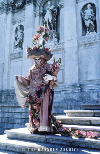 Carnival figure on the steps of Santa Maria della Salute, Venice, Italy (MA-VE-107)